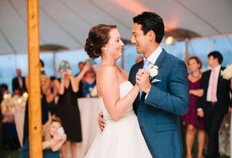 A couple slow dances to their favorite song. 