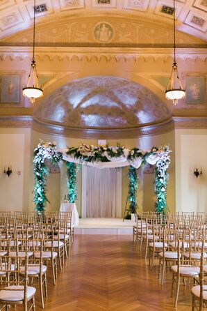 Altar with Floral Chuppah and Gold Chairs