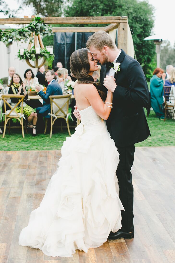 Carly's chic Vera Wang wedding gown matched perfectly with Kevin classically refined black tuxedo. Both ensembles added a touch of elegance to the rustically beautiful day.