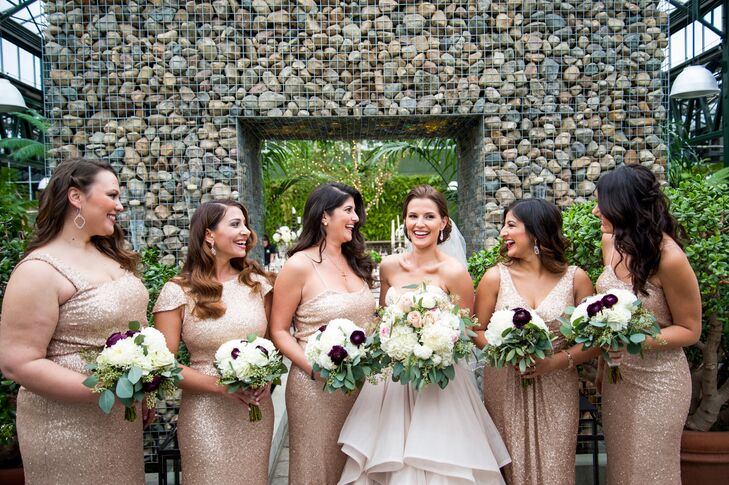Planterra provided the floral arrangements. “I wanted soft and deep colors to match my dress and contrast with all the greenery,” Katina says. The bridesmaids wore sparkling Sorella Vita gowns in blush gold.