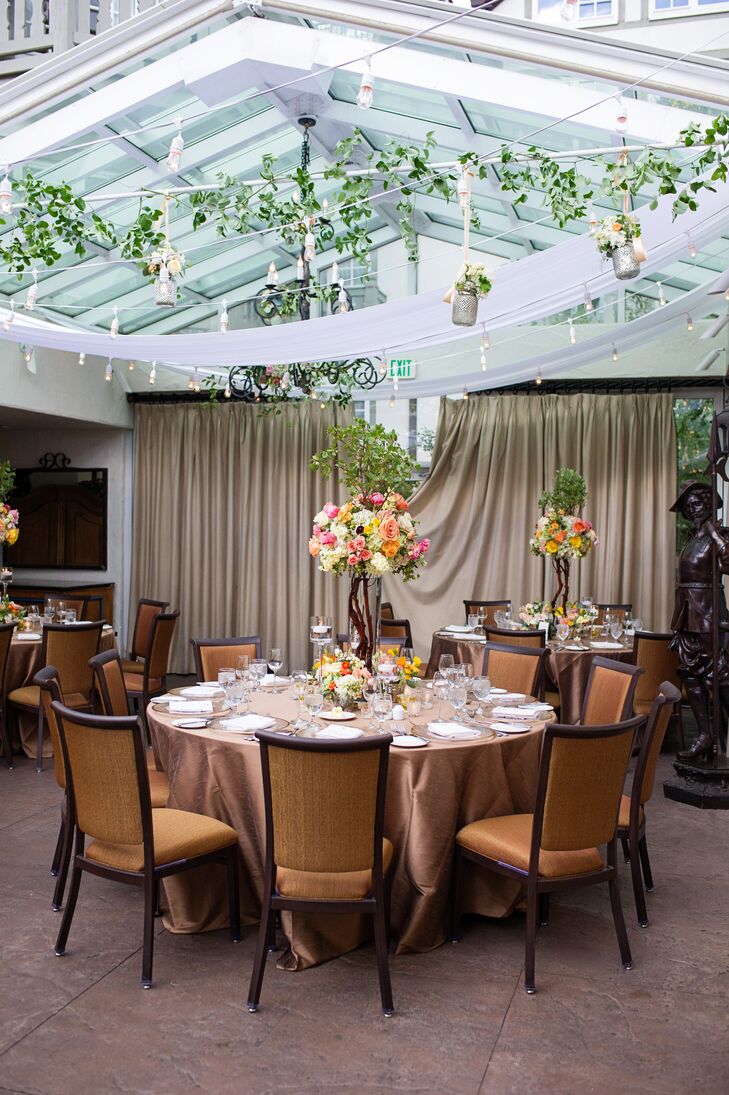 The reception was decorated with draping ivy, hanging mercury glass floral arrangements and string lights for an ethereal garden feel.