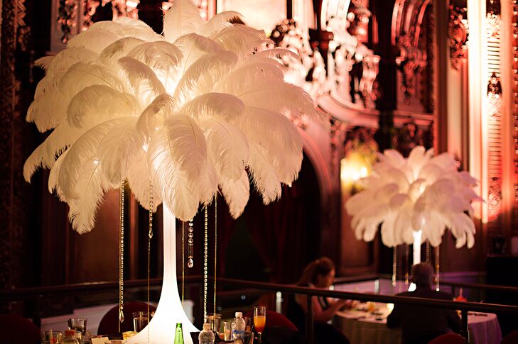 Since Breanne wasn’t big on flowers, the reception tables were decorated with luxe feather and crystal centerpieces to match the luxe 1920s theme.