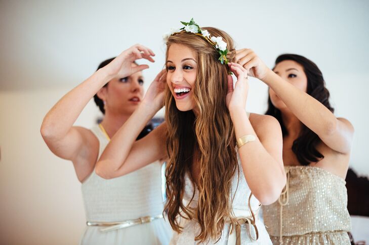 Instead of a traditional veil, Brooke accessorized her long, beachy waves and bohemian bridal look with a flower crown made with small, white blooms.