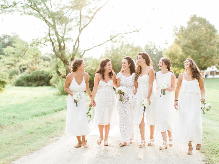 Christine opted for a casual yet modern look for her bridesmaids, letting them choose their own white dresses. “Dresses ranges from Rachel Comey to Reformation, and they looked so stunning and ethereal," Christine says. "I think it was because they were comfortable and felt like themselves."