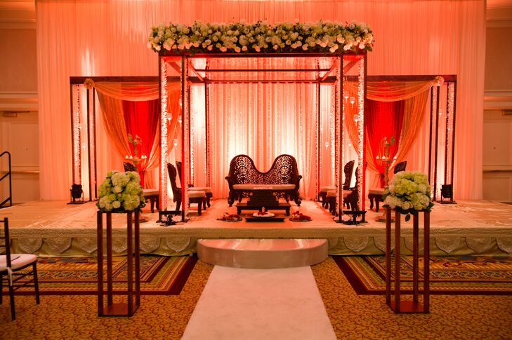 Wedding Mandap With Garlands and Red Lighting