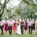 The groomsmen strutted down Lange Farm in a casual look that suited the outdoor setting. They wore blue J.Crew shirts, brown corduroy pants from the Gap and matching dark brown leather suspenders from BuyYourTies.com. Of course, they also wanted a little color to match the bridesmaids. So each man also accented his shirt with a red boutonniere.