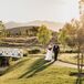 Couple Taking Mountain-View Portraits at River Bottoms Ranch in Midway, Utah