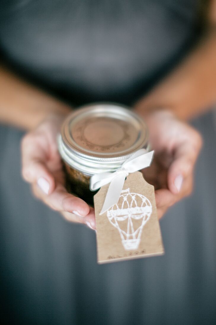 While the decor was largely left up to Amy Young of Leaves of Grass Floral Design, Samantha took on one small DIY project. She made soy candles for all the guests to take home, each decorated with a playful hot air balloon tag displaying the guests’ names and seating assignments.