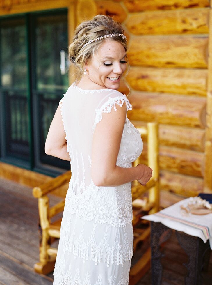 "The first time I saw Claire Pettibone’s Kristene dress, I fell in love and knew that was going to be my wedding dress," the bride says. "It is the perfect combination of romantic, classic, simple and chic. I was able to customize it by having the back lowered, which was one of my favorite details of the dress. Instead of a veil I opted for a gorgeous full-flower crown, which I wore after the ceremony."