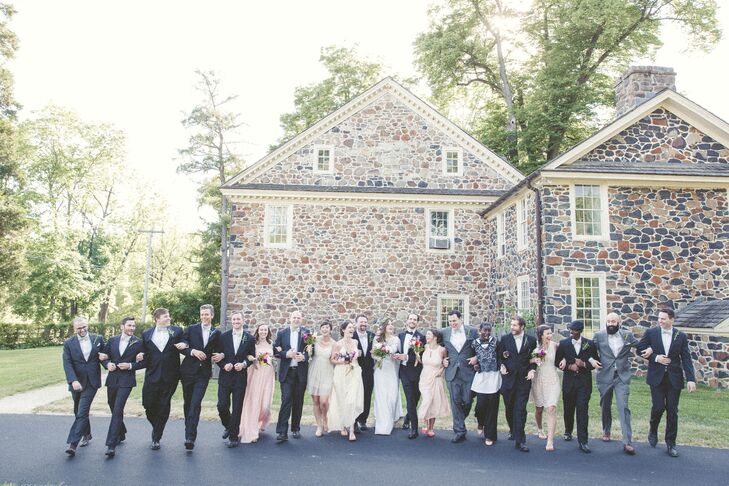 “We didn't want the party to look too formal or alike,” Lauren says. “I mean, we had 5 girls and 12 guys. Why do the norm?” Instead, every member of their wedding party had a different look. We’re talking black suits, gray suits, blush floor-length dresses, short champagne dresses and black lace tops. Only the groomsmen had a cohesive element with the same bow ties from Amanda Jo Homemade. Overall, the looks could not have been more personalized.