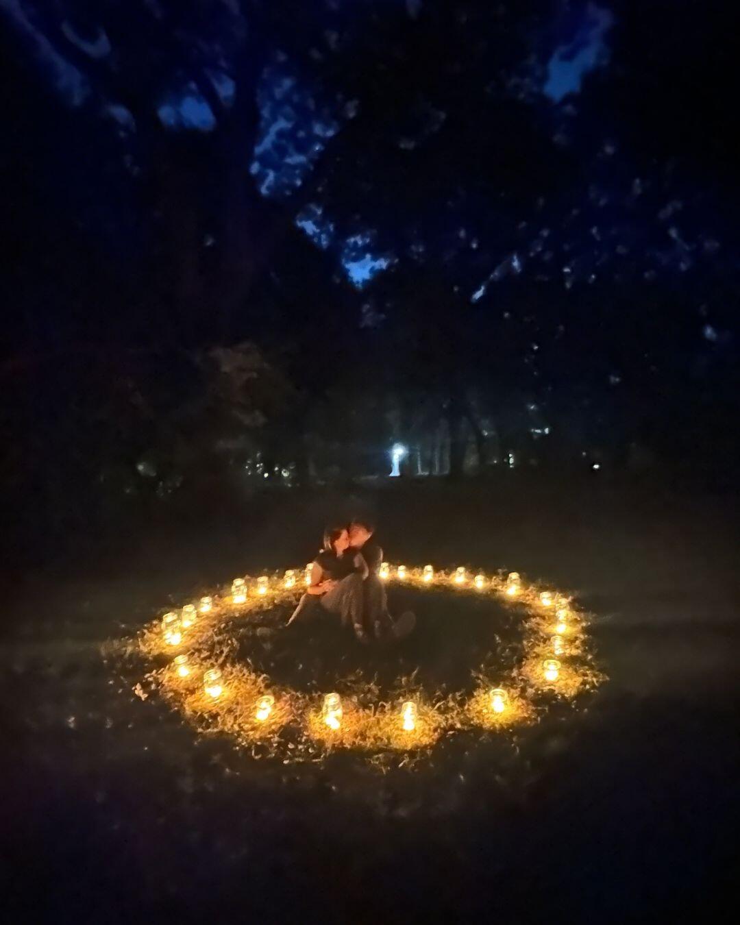Zach proposes to Julie poetically with a ring of candles in the same park where our prom photos were taken
