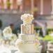 The couple served a grand six-tier wedding cake baked by Cakes by Ron. The berry chantilly cake was covered with blush and ivory sugar flowers, fondant, gold accents and intricate details on every tier.
