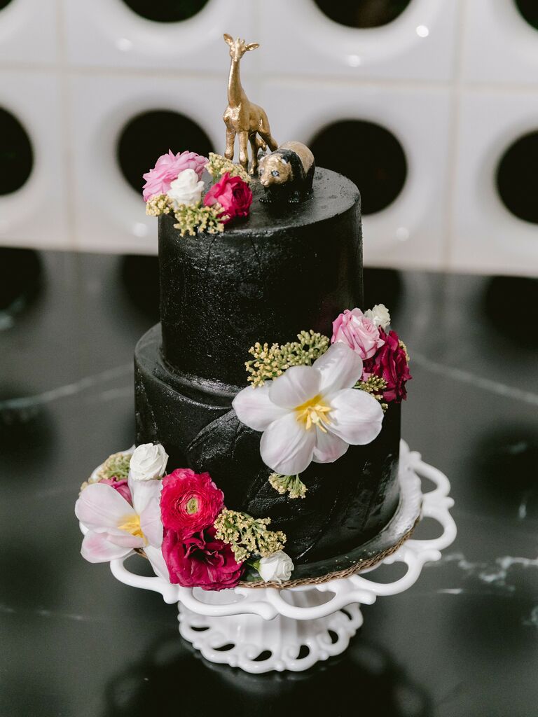 Gold and black giraffe and panda cake toppers. 