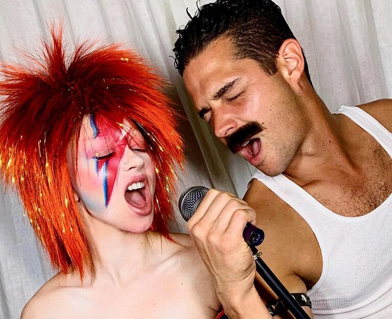 Sarah Hyland and Wells Adams as David Bowie and Freddie Mercury