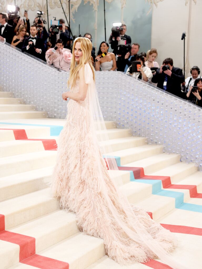 Met Gala 2022: Emma Stone is a vision in a white satin slip dress on her  way to the fashion event