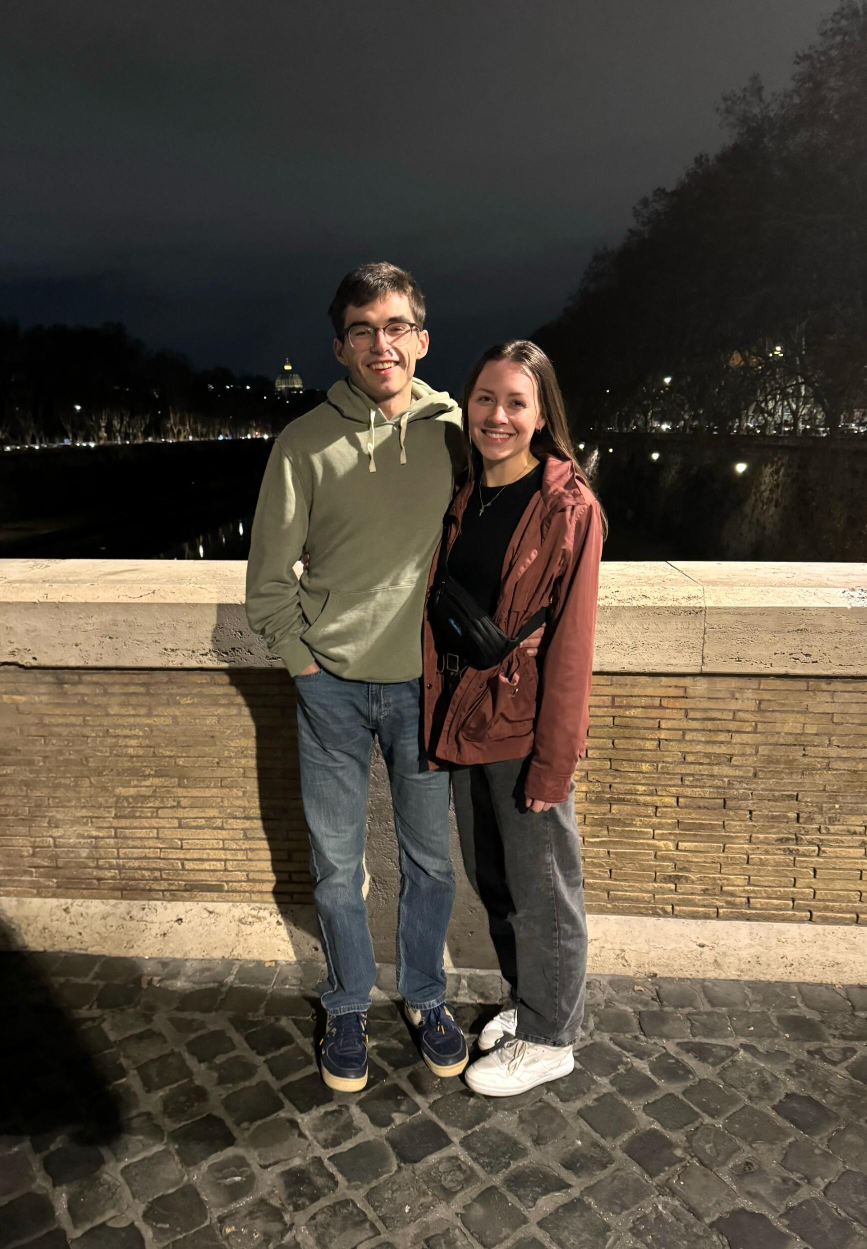 Standing over the Tiber River in Rome with the Vatican cupola behind us