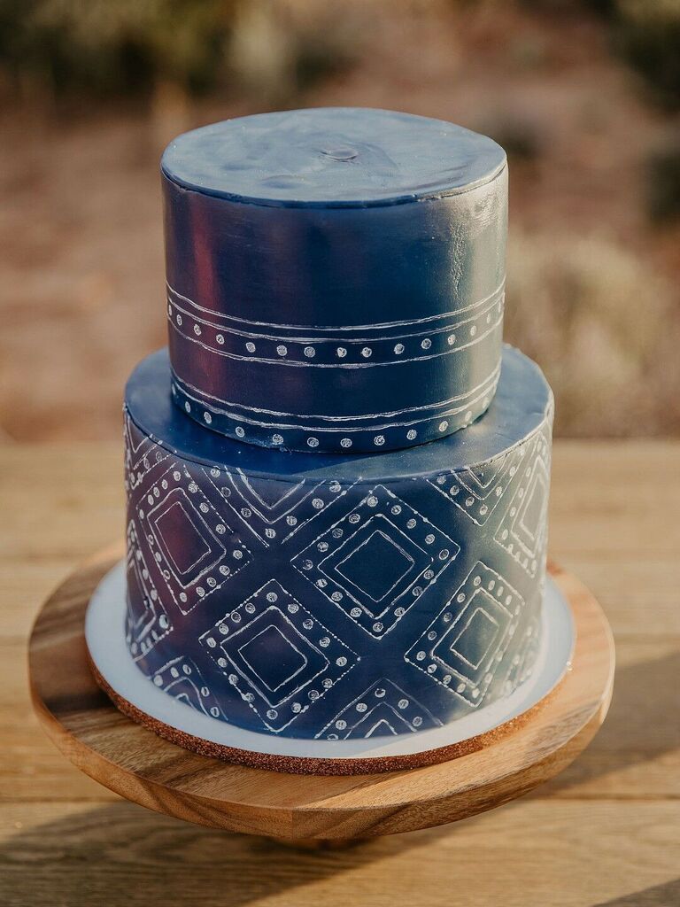 navy blue fondant wedding cake with geometric white bandana pattern