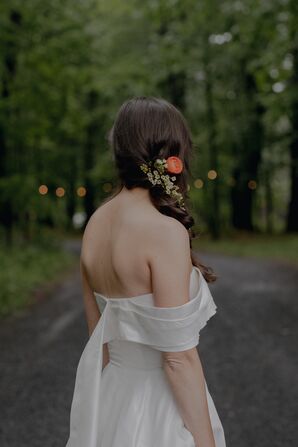 Bride With Long Braid Hairstyle With Bright Fresh Flowers In