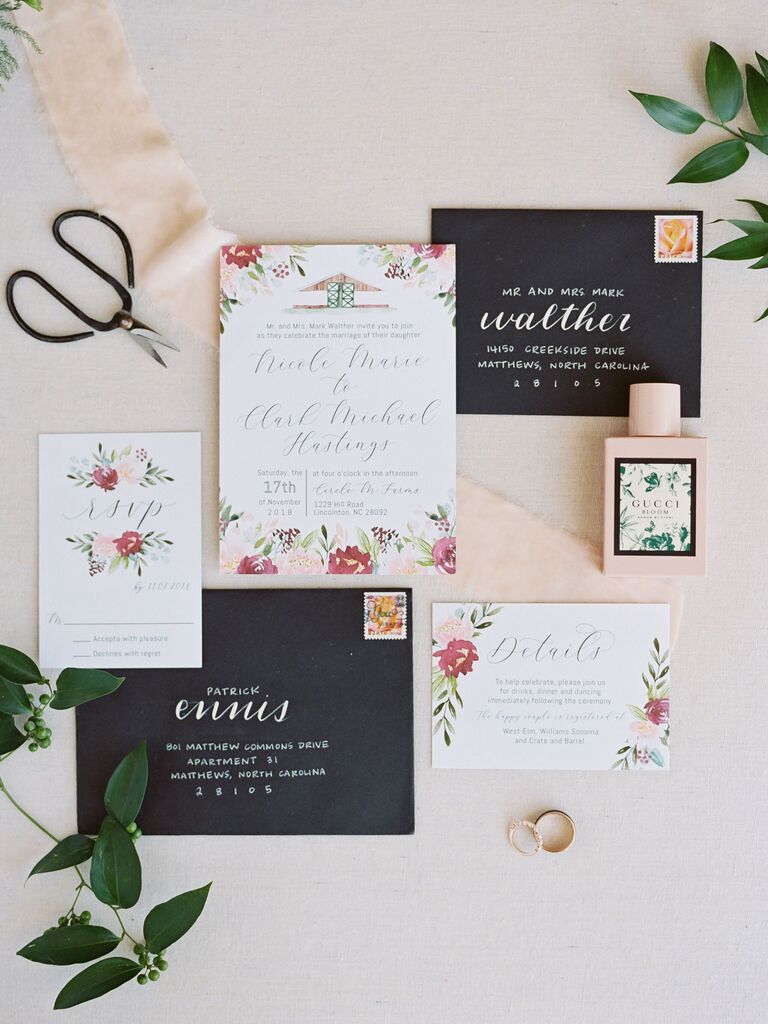 Floral wedding invitation suite with stamped black envelopes