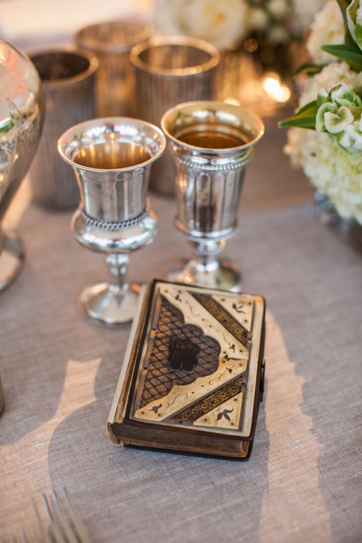 Nora incorporated her ancestors into her ceremony. Not only was she married in her great grandmother's gold wedding band, but she walked down the aisle holding her paternal great grandfather's prayer book.