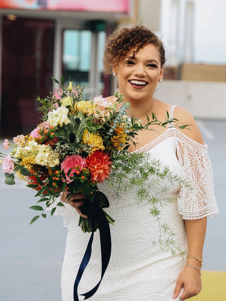 natural wedding hairstyles low bun with bangs