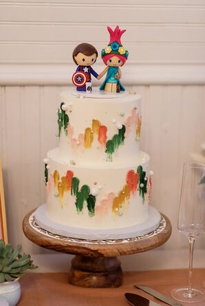 Rainbow-Colored Two-Tier Wedding Cake With Avengers Action Figure Cake Toppers
