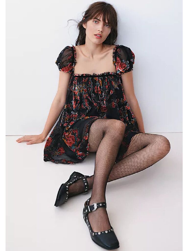 Black cap sleeve mini dress with red floral print