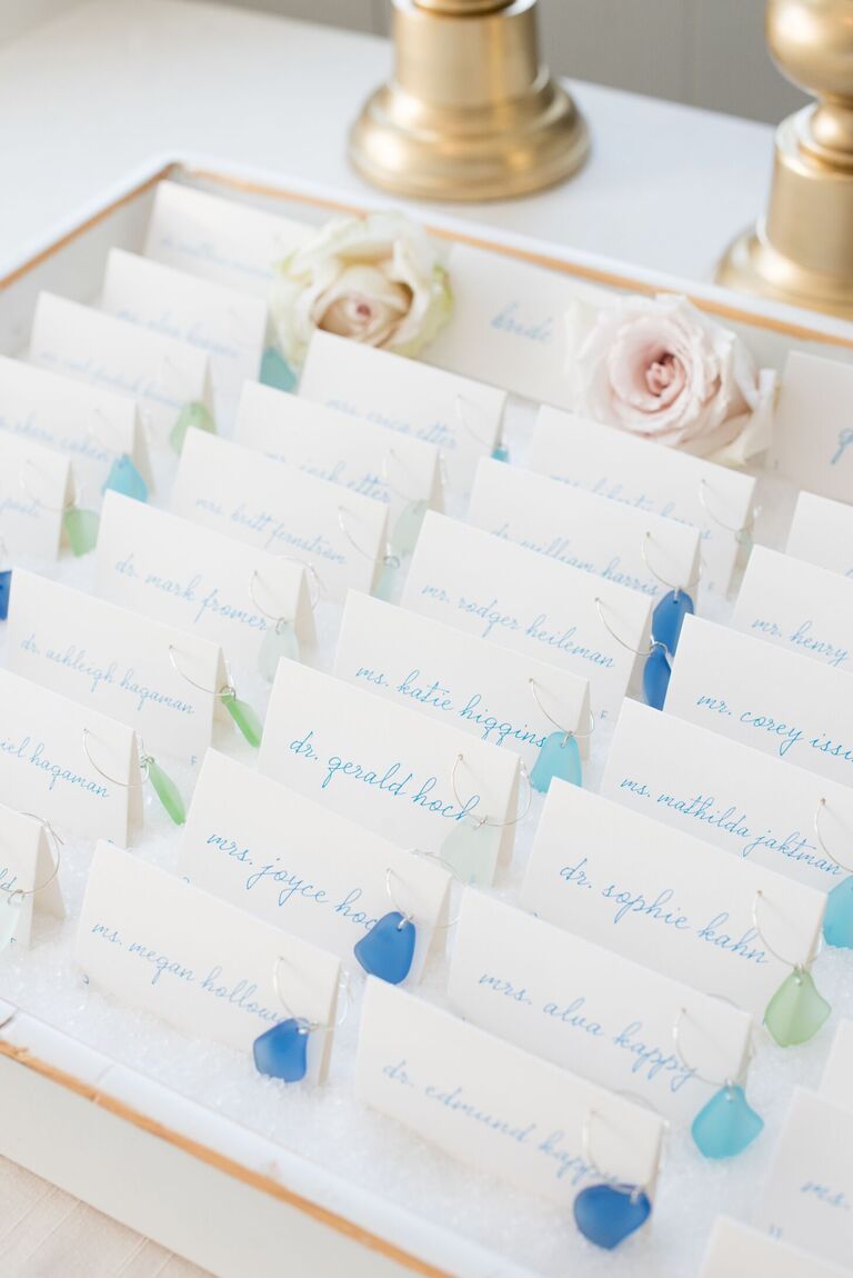 Escort cards with sea glass wine charms