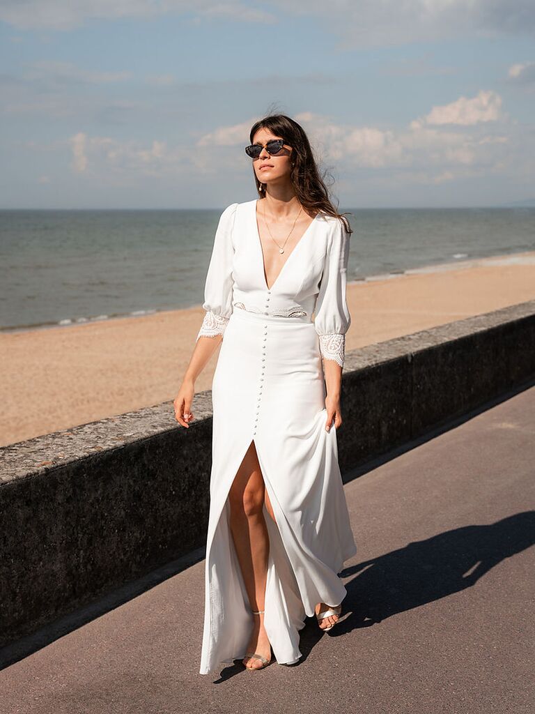 Model wears a wedding dress by French designer Mademoiselle De Guise. 