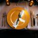 Pine- and Gold-Ribbon-Adorned Place Settings
