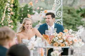 Romantic Couple at Sweetheart Table with Rose Flower Arrangement