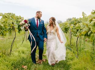 Brianna Wood and Jason Springs pulled off a glam bohemian bash for their mid-summer wedding at an Indianapolis vineyard. Wild, organic florals with lo