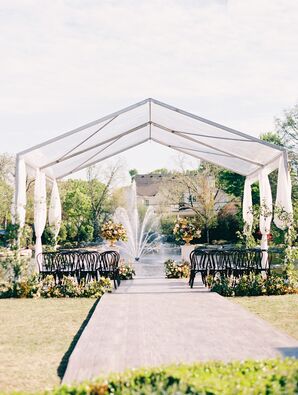Waterfront Wedding Ceremony With Black Bentwood Chairs and Clear Tent