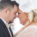 Bride and Groom Head-to-Head in a Sheer-Sleeved Dress and Dark Gray Suit