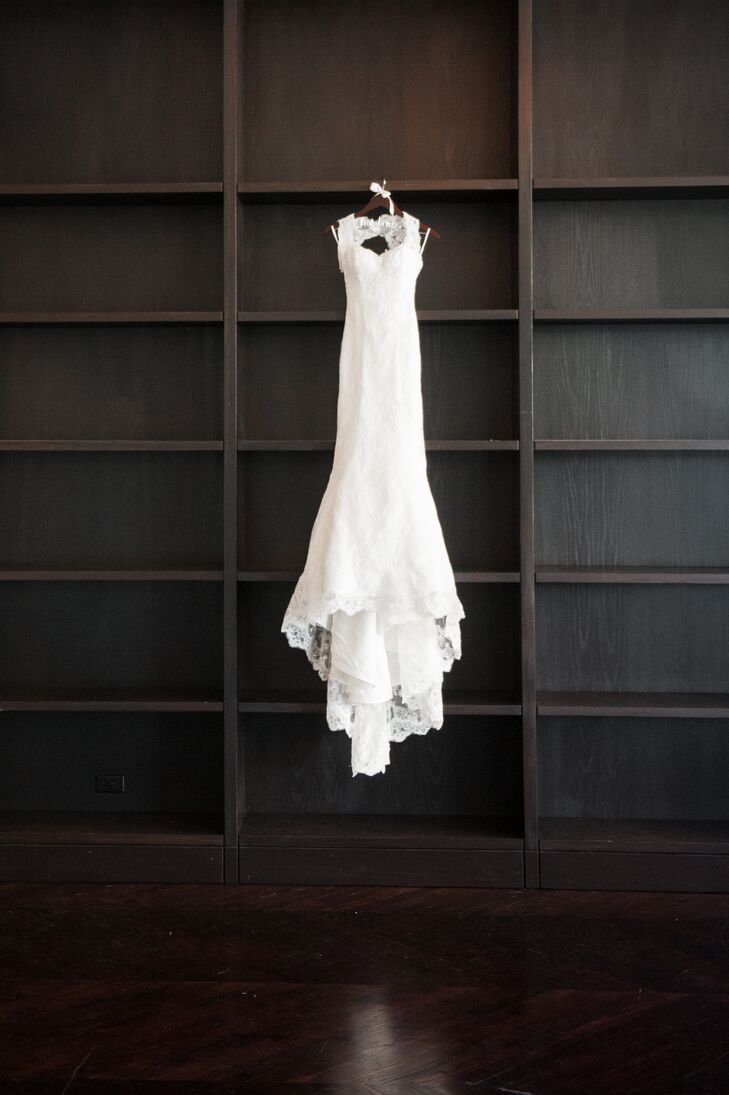 The bride wore a classic, white dress by Marisa with simple sleeves and a lace detail.