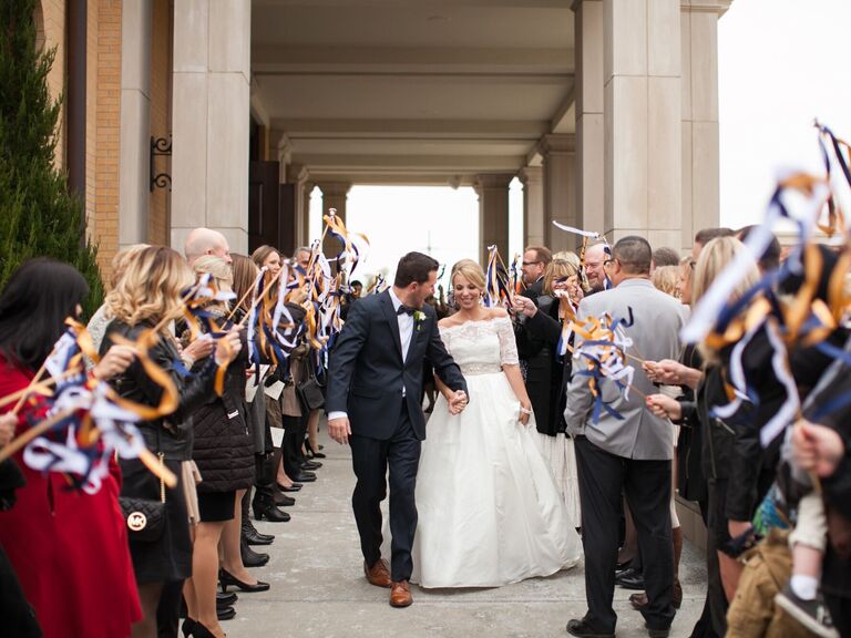 Guests waving ribbon wands at the end of the ceremony. 
