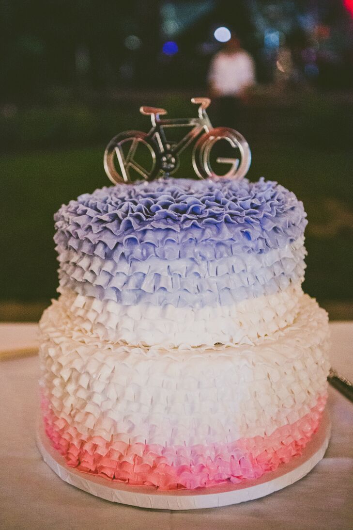 Keeping with the bicycle theme, the couple's ruffled ombre cake was topped with a bicycle cake topper. The cake was flavored peanut butter chocolate.
