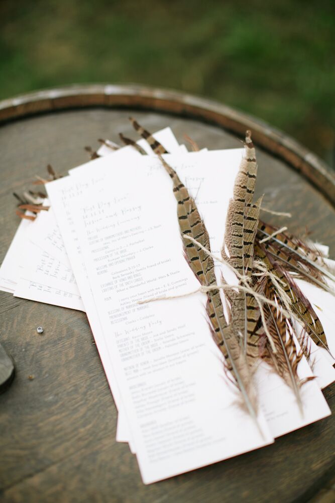 Jessica and Bassey’s programs were printed on kraft paper and had a pheasant feather (Jessica’s favorite) tied with twine onto the side. They were displayed in an old wooden bottle crate on top of wooden barrels to match the rustic-meets-bohemian theme.