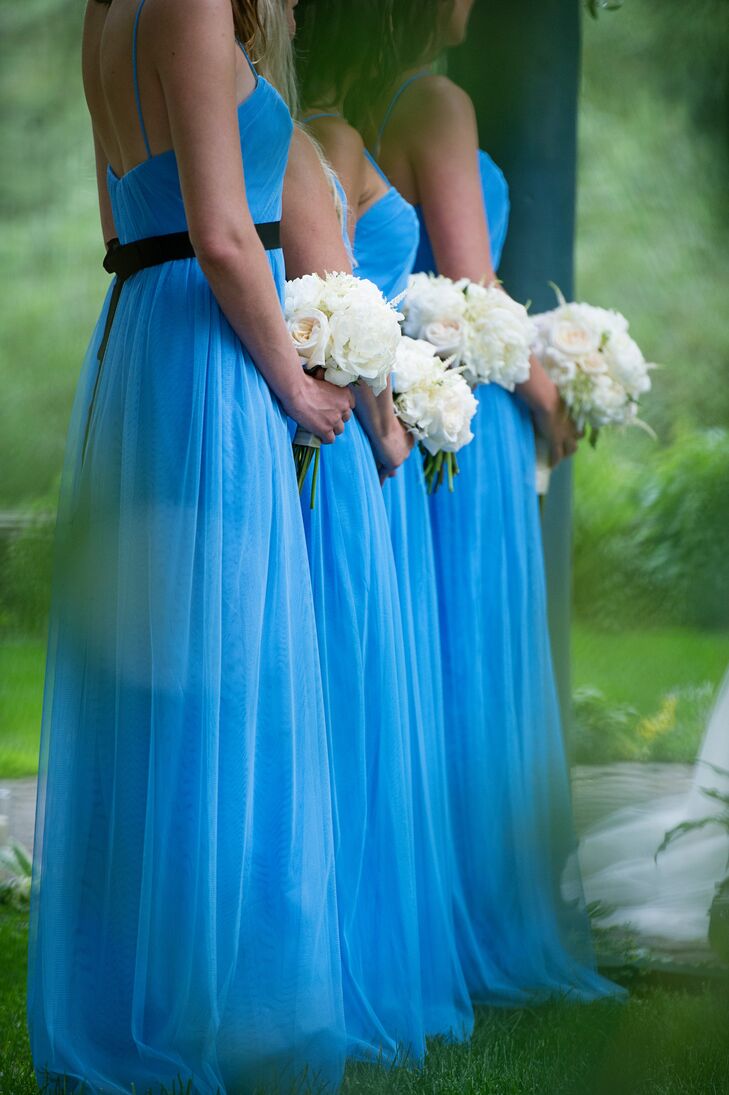 The bridesmaids carried white posies of peonies, roses, white satiable and touches of ivy.