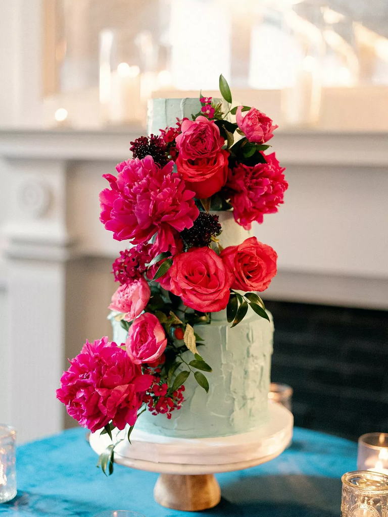 This pale blue cake with vibrant fuchsia-shaded flowers is sure to be a hit.