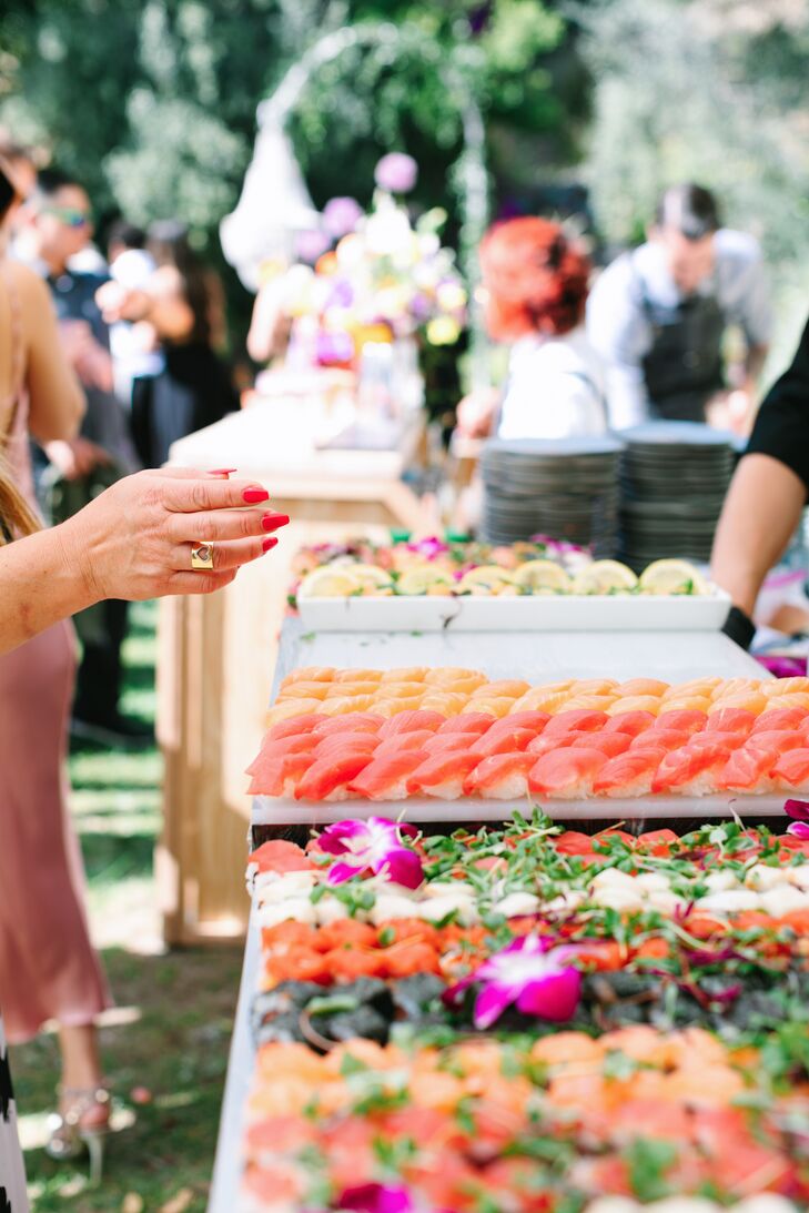 Guests enjoyed a sushi spread early on while Persisrnand Crystal changed into their dresses. Later, the menu included fries, miso cod, vegan lasagna and risotto. “To end the night on a sweet note, we couldn’t resist having a churro station, as it is a treat we both adore.”