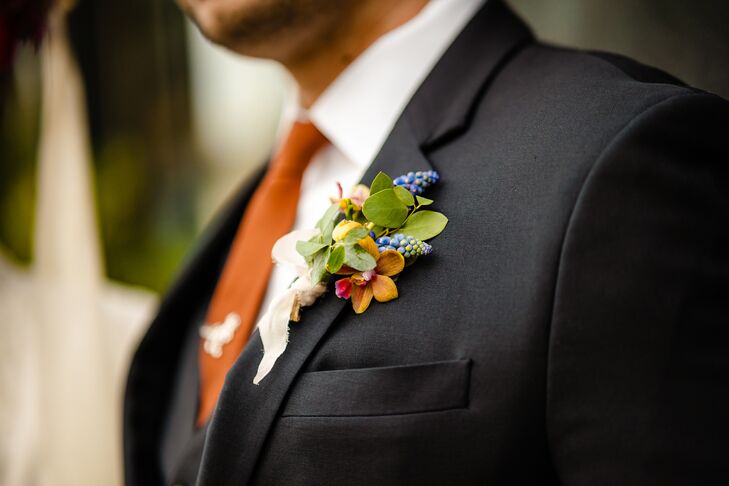 Orange Tie and Colorful Boutonniere