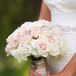 Lauren's bouquet continued the soft color palette with pink spray roses and white hydrangeas.