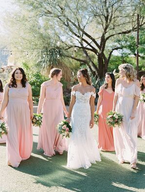 Bride Walking Beside Bridesmaids in Peach-Hued Dresses