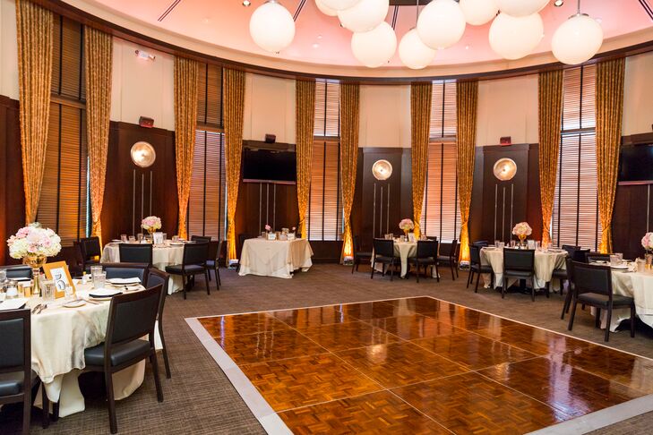 Blush pink lighting brought the ceremony and reception rooms to life. "The lighting was perfect!" the bride says. "It made the ceremony room look magical and made the reception pop even better."