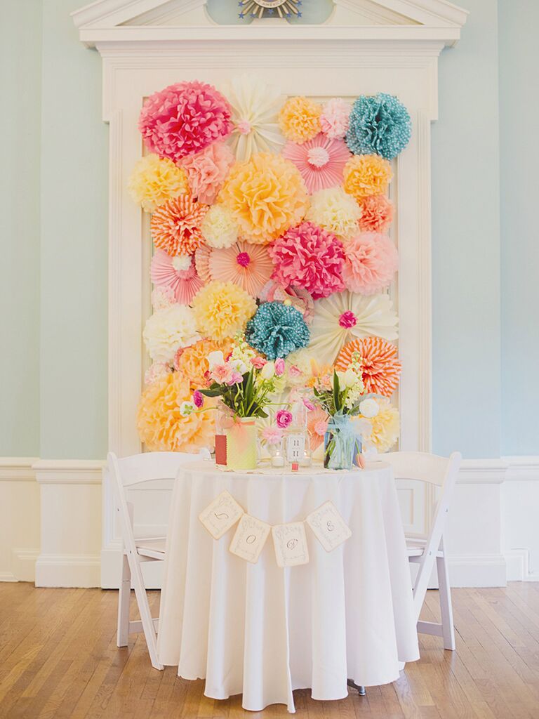 Colorful tissue paper sweetheart table backdrop