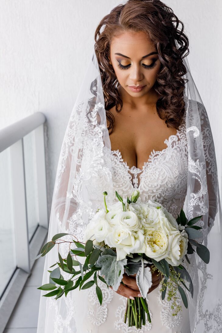 Bride with Lace Detailing on Veil and Wedding Dress Neckline
