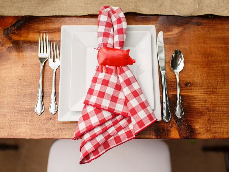 Charming table setting featuring red and white checkered napkins. 