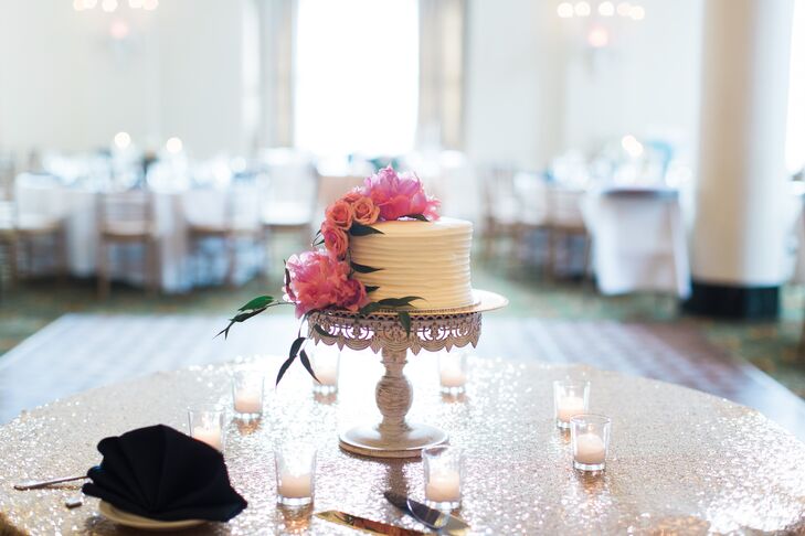 Brianna and Eric chose their favorite flavor for the wedding cake: red velvet. Their pastry chef covered the single-tier confection in cream cheese frosting before adding cascading pink peonies and roses to the side. “We both wanted to give everybody a choice, so we did a mix of different-flavored cupcakes from Oakmont Bakery,” Brianna says. “There was also a traditional Pittsburgh wedding cookie table filled with cookies baked by Eric's mom, his grandma, his aunts, my sister and my mother.”