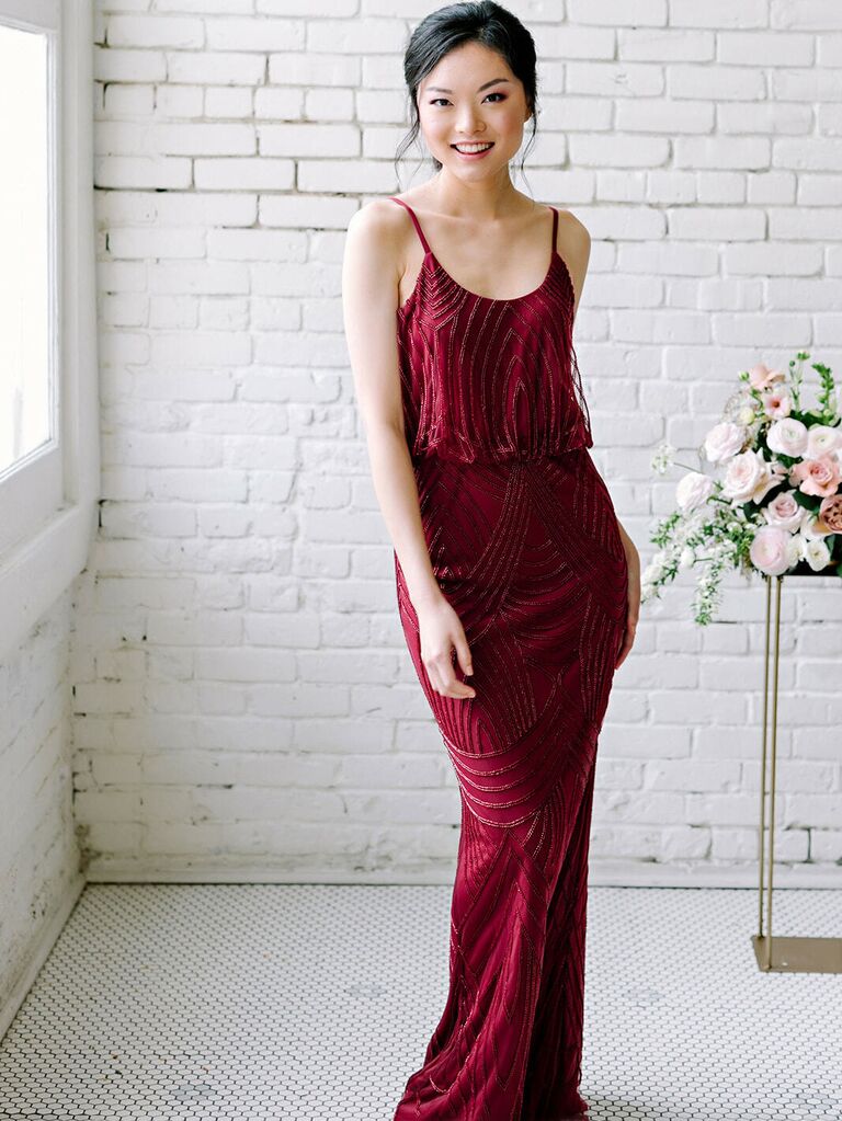 Burgundy full length dress with all over embellishments, spaghetti straps and scoop neck